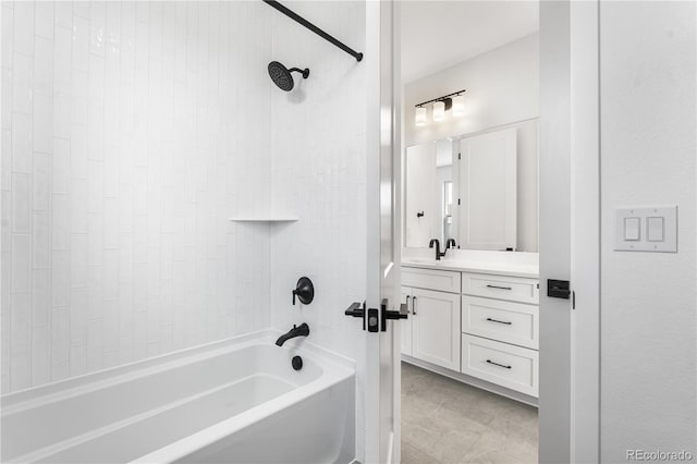 bathroom with tile patterned flooring, vanity, and shower / bathtub combination