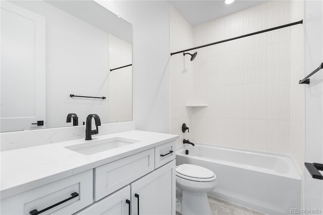 bathroom featuring  shower combination, vanity, and toilet