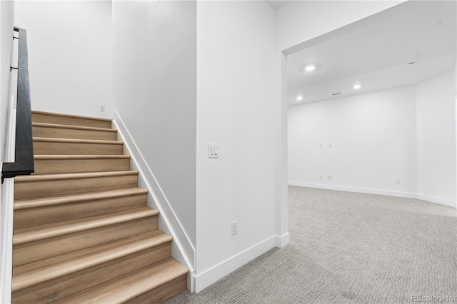 stairway featuring recessed lighting, carpet, and baseboards