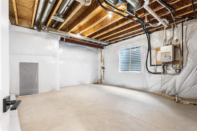 unfinished basement featuring water heater