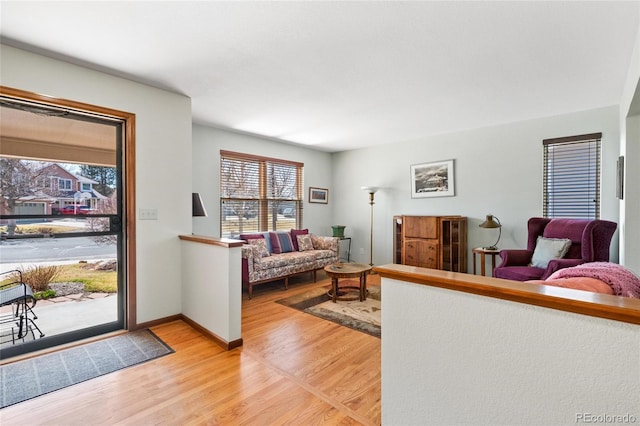3151 E 134th Cir, Thornton, CO 80241 - living room featuring light wood-type flooring, healthy amount of natural light, and baseboards