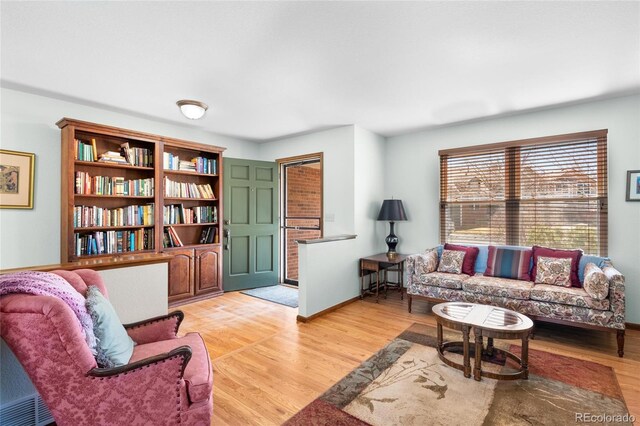 3151 E 134th Cir, Thornton, CO 80241 - living room with light wood finished floors and baseboards
