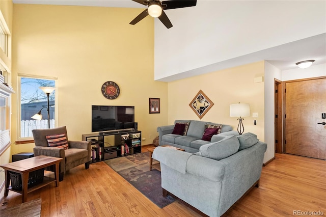 3151 E 134th Cir, Thornton, CO 80241 - living area with a towering ceiling, wood finished floors, and ceiling fan