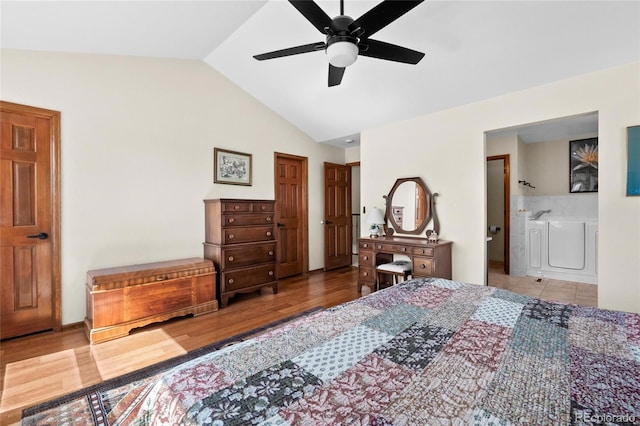 3151 E 134th Cir, Thornton, CO 80241 - bedroom with lofted ceiling, wood finished floors, ensuite bathroom, and a ceiling fan