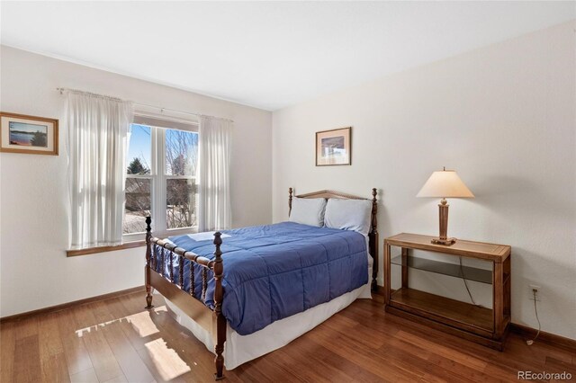 3151 E 134th Cir, Thornton, CO 80241 - bedroom featuring wood finished floors and baseboards
