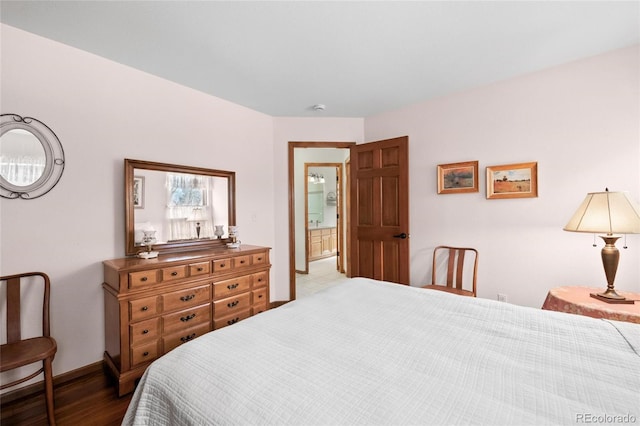 3151 E 134th Cir, Thornton, CO 80241 - bedroom featuring wood finished floors and baseboards