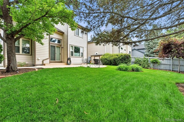 3151 E 134th Cir, Thornton, CO 80241 - rear view of house with a patio