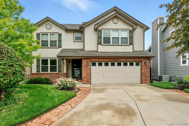 3151 E 134th Cir, Thornton, CO 80241 - view of front of property with brick siding, concrete driveway, and a garage