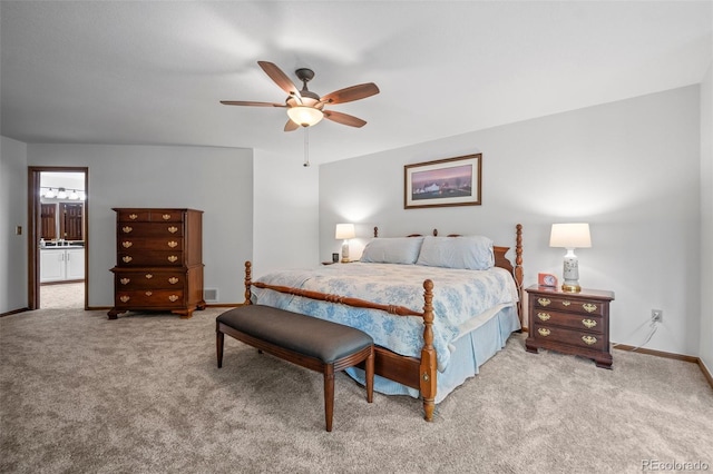 4161 W Lake Cir N, Littleton, CO 80123 - carpeted bedroom with baseboards, a sink, a ceiling fan, and ensuite bath