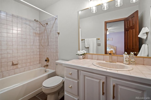 4161 W Lake Cir N, Littleton, CO 80123 - ensuite bathroom featuring vanity, bathtub / shower combination, toilet, and ceiling fan