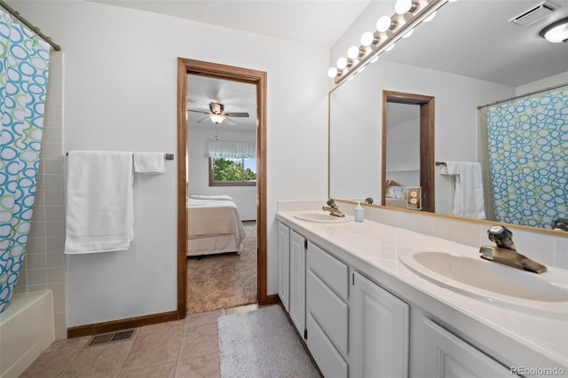 4161 W Lake Cir N, Littleton, CO 80123 - ensuite bathroom with double vanity, ceiling fan, baseboards, and shower / bath combo