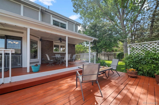 4161 W Lake Cir N, Littleton, CO 80123 - deck with outdoor dining space and a ceiling fan