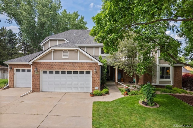 4161 W Lake Cir N, Littleton, CO 80123 - view of front of house featuring driveway, a front yard, a garage, stucco siding, and roof with shingles