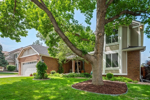 4161 W Lake Cir N, Littleton, CO 80123 - view of front of home with brick siding, a front yard, and a garage