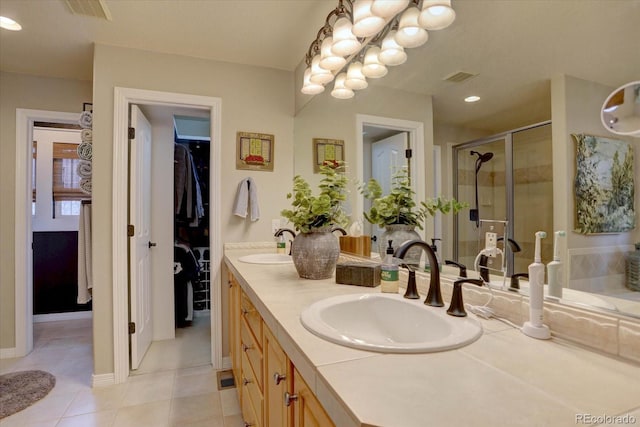 full bathroom featuring visible vents, a sink, a stall shower, and double vanity