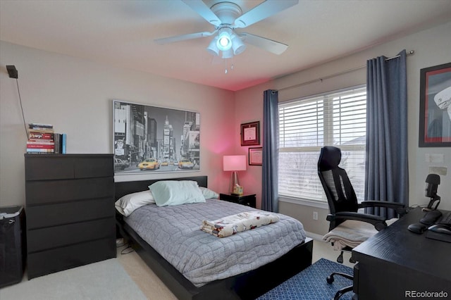 bedroom with light carpet and ceiling fan