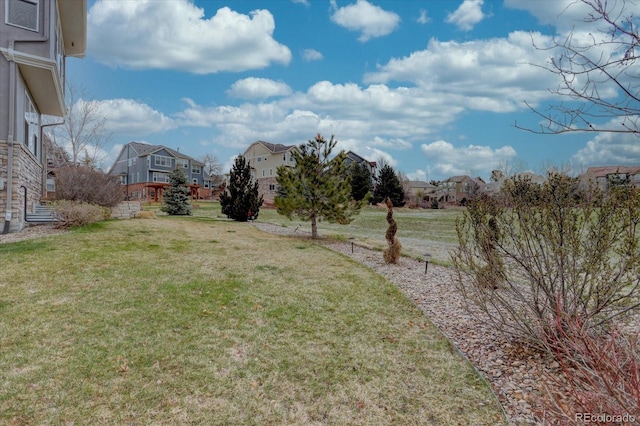 view of yard featuring a residential view