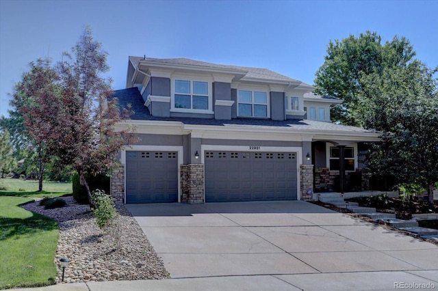 22921 E Euclid Cir, Aurora, CO 80016 - prairie-style home with stucco siding, an attached garage, stone siding, and driveway