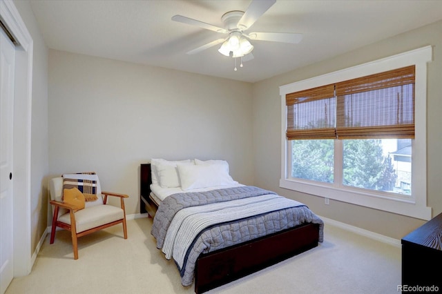 22921 E Euclid Cir, Aurora, CO 80016 - bedroom with light carpet, a ceiling fan, and a closet