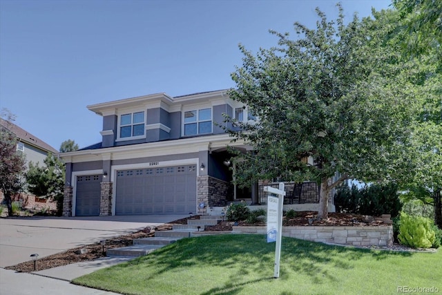 22921 E Euclid Cir, Aurora, CO 80016 - view of front of property with stucco siding, stone siding, an attached garage, driveway, and a front yard