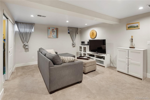 living room featuring baseboards, visible vents, recessed lighting, and light colored carpet