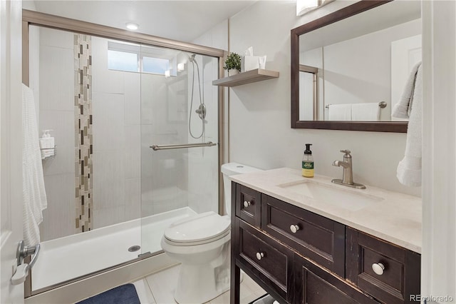 full bathroom with vanity, toilet, and a shower stall