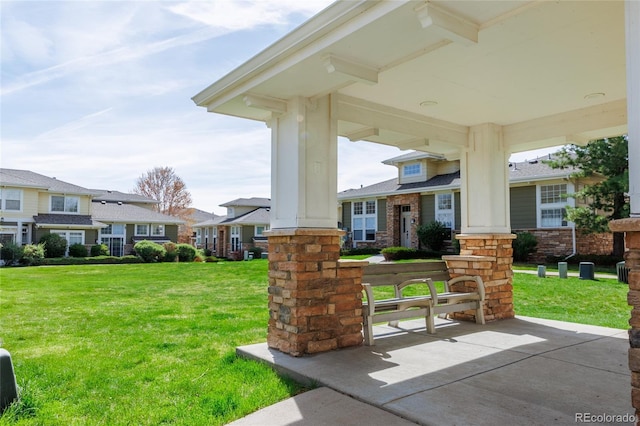 3000 E 112th Ave Unit 102, Northglenn, CO 80233 - porch featuring a yard and a residential view