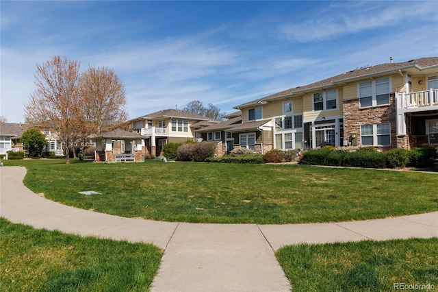 3000 E 112th Ave Unit 102, Northglenn, CO 80233 - view of property's community featuring a lawn and a residential view