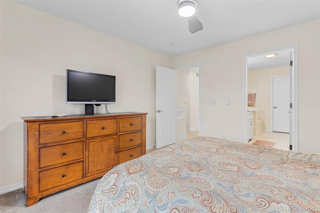 3000 E 112th Ave Unit 102, Northglenn, CO 80233 - bedroom with baseboards and light carpet