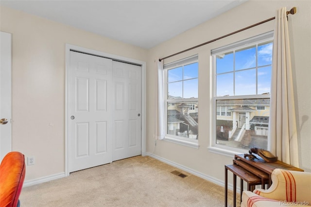 3000 E 112th Ave Unit 102, Northglenn, CO 80233 - living area with carpet and baseboards
