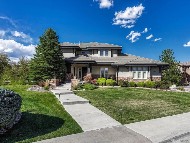 prairie-style home with a front lawn