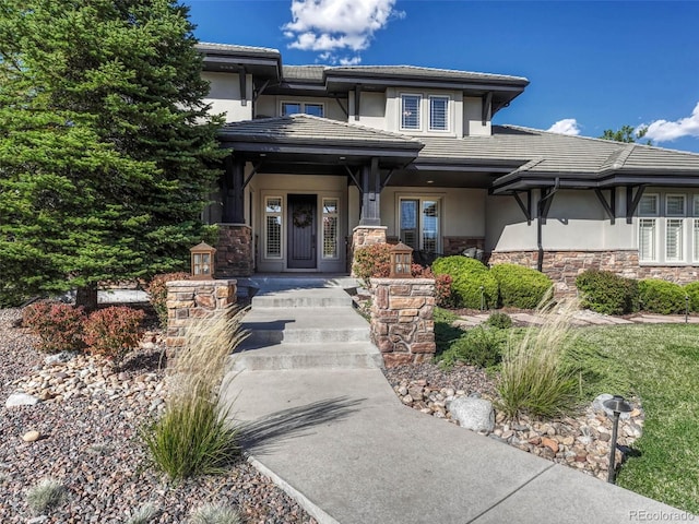 prairie-style home featuring covered porch