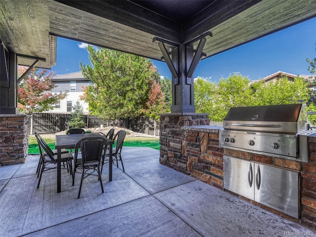 view of patio / terrace with an outdoor kitchen and grilling area