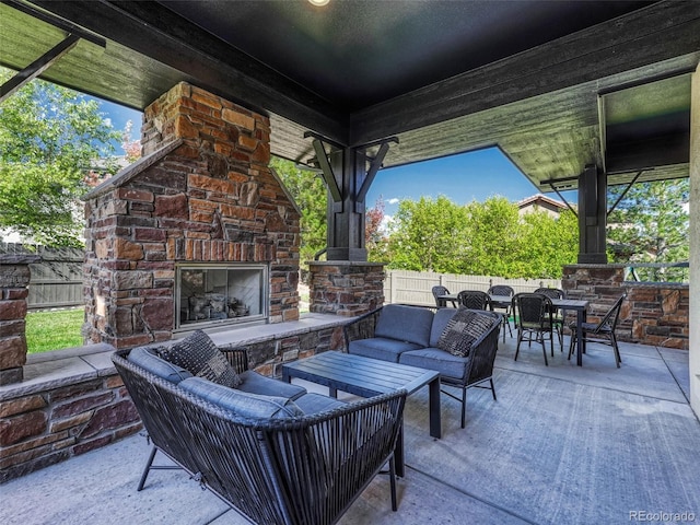 view of patio / terrace featuring an outdoor living space with a fireplace