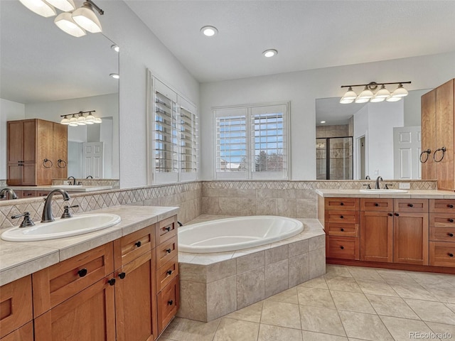 bathroom featuring decorative backsplash, vanity, separate shower and tub, and tile patterned flooring