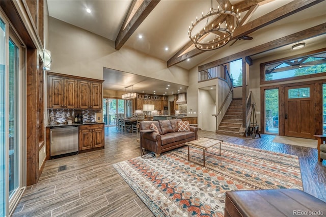 25735 County Road 295, Nathrop, CO 81236 - living area with high vaulted ceiling, stairs, beam ceiling, light wood-style flooring, and recessed lighting
