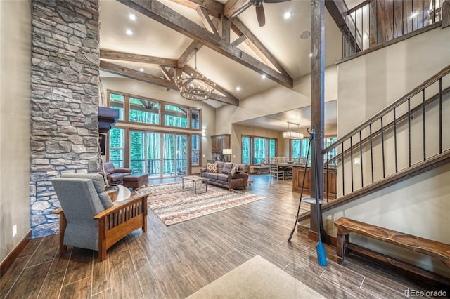 25735 County Road 295, Nathrop, CO 81236 - living area with high vaulted ceiling, a chandelier, wood finished floors, beam ceiling, and stairs