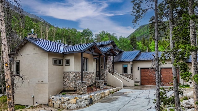 25735 County Road 295, Nathrop, CO 81236 - view of front of home with a standing seam roof, stucco siding, and a metal roof