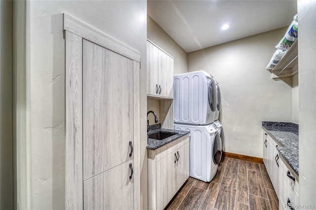 25735 County Road 295, Nathrop, CO 81236 - laundry room featuring cabinet space, stacked washer / dryer, and wood tiled floors