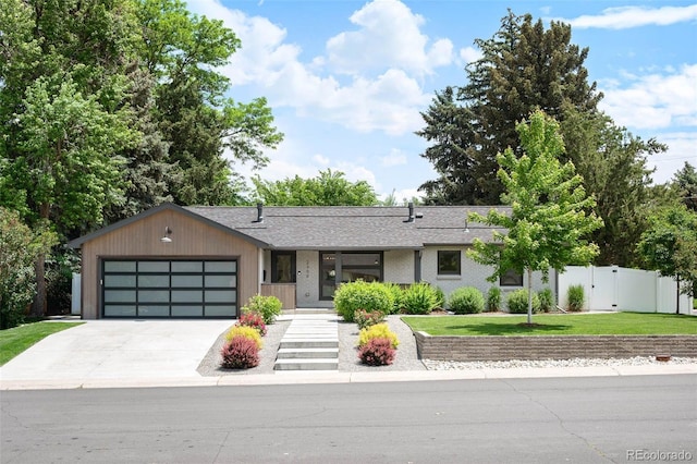 2998 S Adams St, Denver, CO 80210 - view of front of property featuring an attached garage, driveway, and roof with shingles