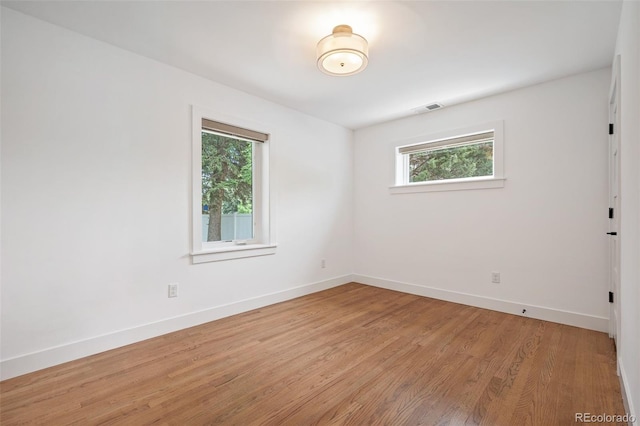 2998 S Adams St, Denver, CO 80210 - spare room with plenty of natural light and light wood finished floors