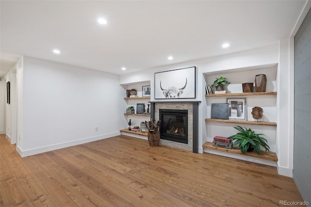 2998 S Adams St, Denver, CO 80210 - unfurnished living room featuring wood finished floors, a stone fireplace, and recessed lighting