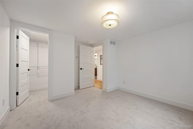 2998 S Adams St, Denver, CO 80210 - unfurnished bedroom with carpet flooring, a closet, and a walk in closet