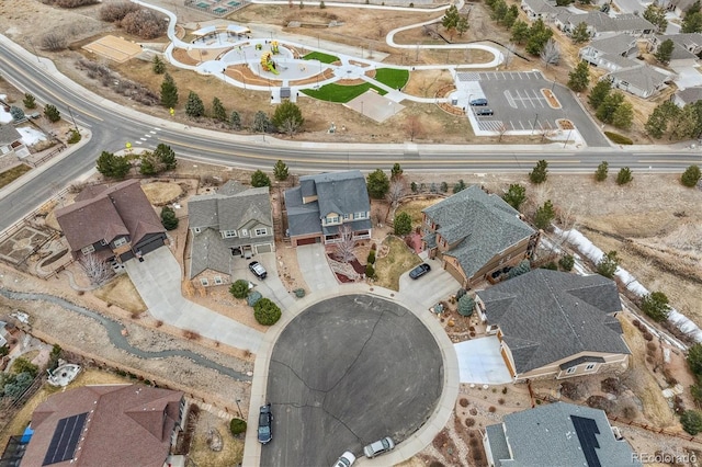 birds eye view of property with a residential view