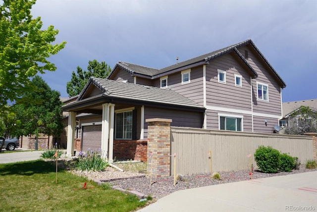 9616 Nucla St, Commerce City, CO 80022 - view of front of property with an attached garage and brick siding