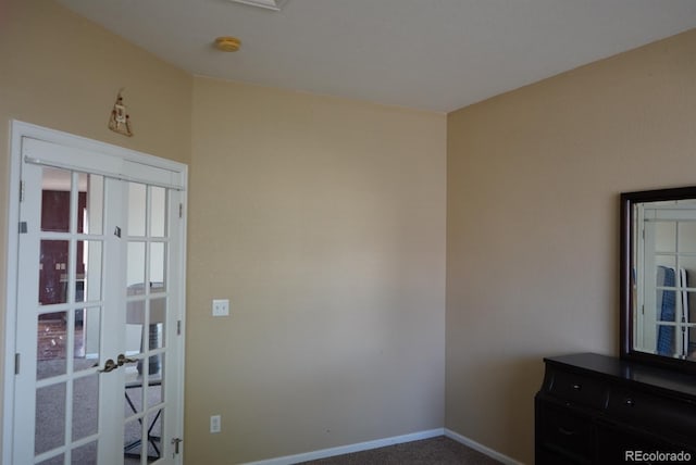 9616 Nucla St, Commerce City, CO 80022 - unfurnished room featuring french doors, a smoke detector, baseboards, and carpet flooring
