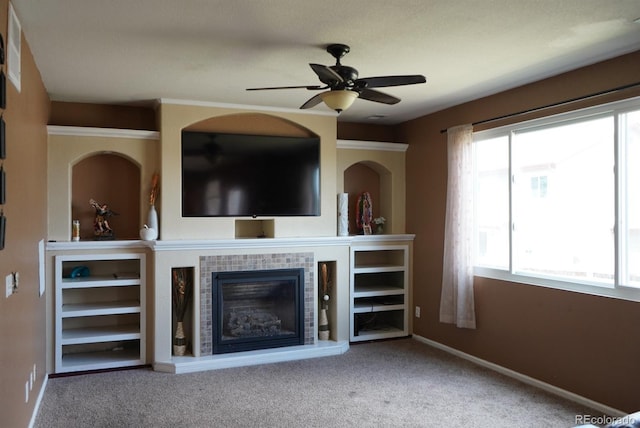 9616 Nucla St, Commerce City, CO 80022 - unfurnished living room featuring ceiling fan, a tile fireplace, carpet flooring, and baseboards