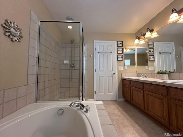 9616 Nucla St, Commerce City, CO 80022 - bathroom featuring double vanity, a garden tub, a shower stall, and tile patterned floors