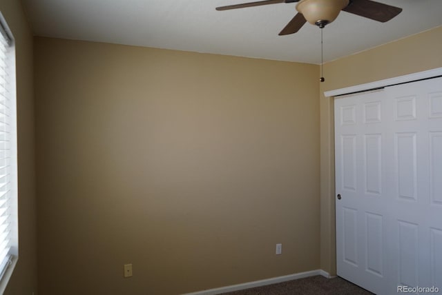 9616 Nucla St, Commerce City, CO 80022 - unfurnished bedroom featuring dark carpet, baseboards, a closet, and a ceiling fan