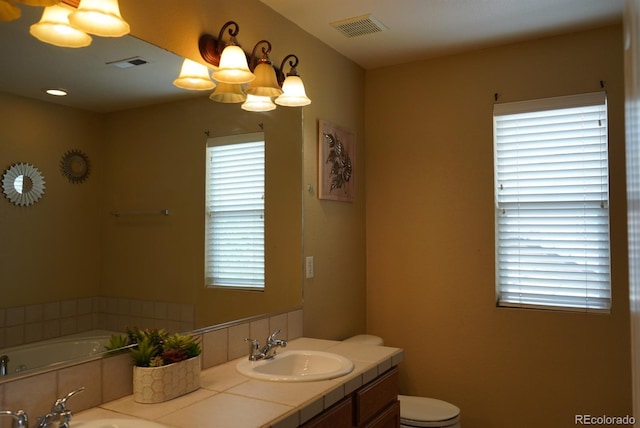 9616 Nucla St, Commerce City, CO 80022 - full bath with double vanity, healthy amount of natural light, and a bath